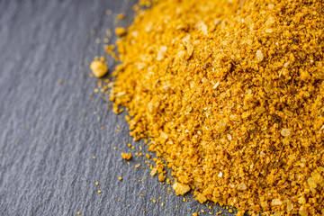 svanetian salt on a black stone background