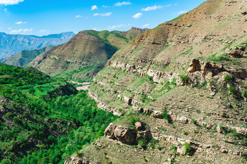 mountain landscape of the North Caucasus, rocky cliffs over a green valley