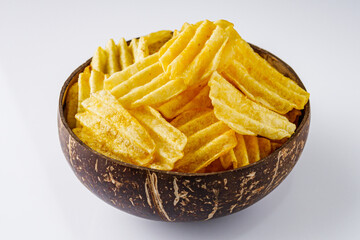 golden crispy potato chips on a white background