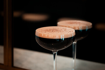 Espresso Martini Cocktail Next to a Mirror
