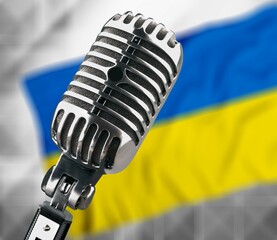 Microphone on a background of a blurry flag Ukraine, news concept