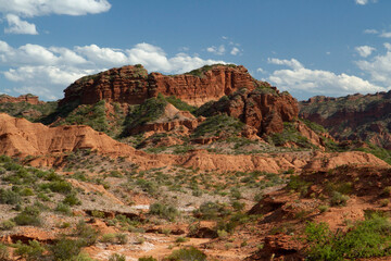 The red desert. View of the canyon, sandstone and rocky mountains under a blue sky.	