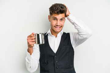 Young caucasian barista man isolated on yellow background being shocked, she has remembered...