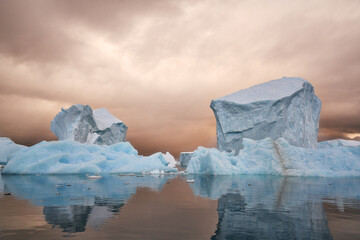 Antartica scenary beautifully combining mountains with sea and icebergs