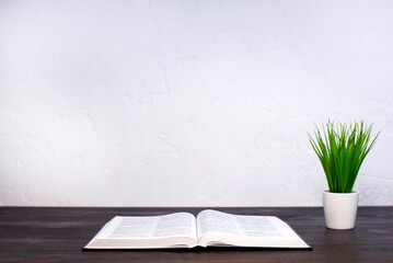 The Bible is open. Holy Bible, on the table. Prayer.