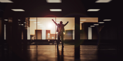 Successful businessman - rejoicing and spreads his hands in an office building with the setting sun - 3d illustration silhouette