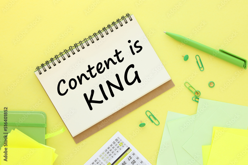 Aufkleber content is king yellow background with text on an open notepad ,business analysis and strategy as co