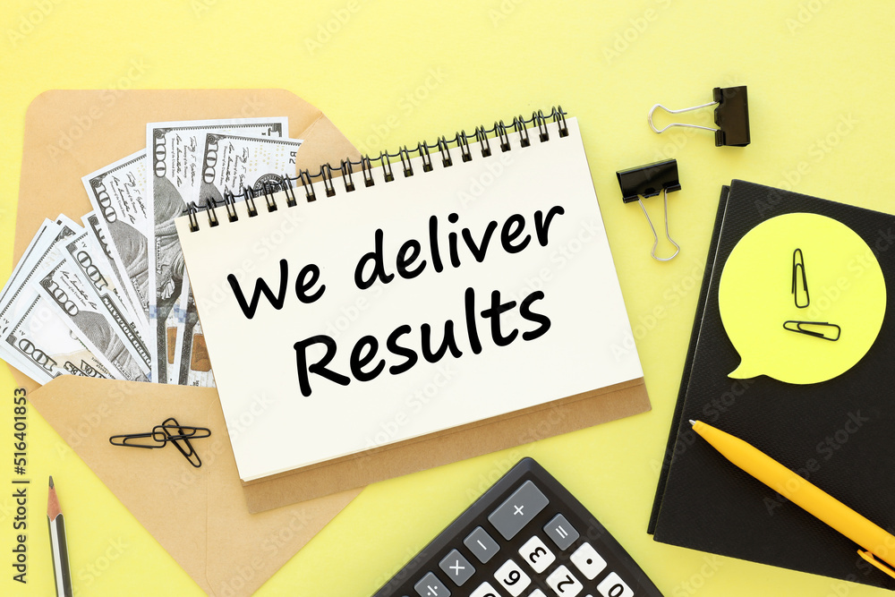 Poster we deliver results . yellow background with text on an open notepad, money calculator in an envelope