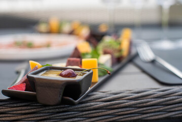Fruit, meat and cheese assortment on the table. Exquisite food