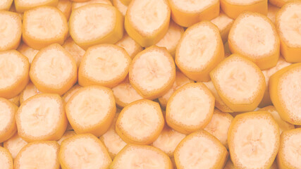 Fresh banana slices background. Top view.