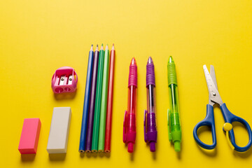 Image of school drawing tools on yellow surface with copy space