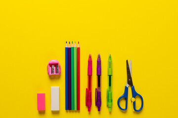 Image of school drawing tools on yellow surface with copy space