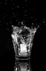 Action water splashes from the glass.