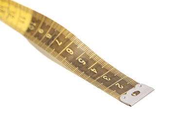 Yellow measuring tape isolated on a white background