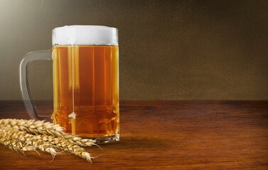 beer ingredients, barley near beer glass on the desk