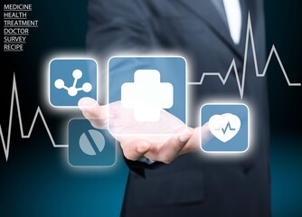 Businessman hand holding virtual medical health care icons. People health care awareness, life insurance business.