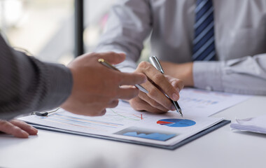 Fototapeta premium Close up of Team businesswoman Accounting using calculating income-expenditure and analyzing real estate investment data report Financial and tax systems concept. 