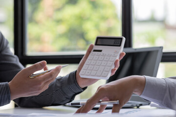 Team of Businessman working at office with documents on his desk, doing planning analyzing the financial report, business plan investment, finance analysis concept	
