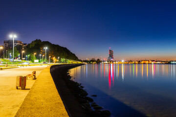 Noctilucent clouds over the Gdynia cityscape at night. Poland