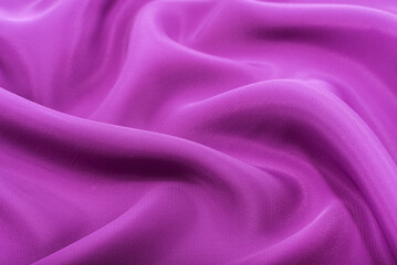 A piece of burgundy, violet, red cloth. Fabric texture for background and design works of art,...