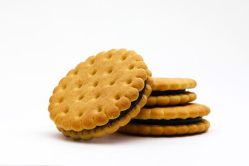 Round cookies with chocolate filling on a white background. Shallow depth of field