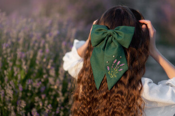 girl in lavender field long hair bow decoration