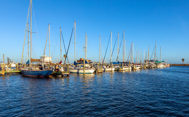 Fototapeta na wymiar Sailboats in harbor in the evening. Rockport Texas