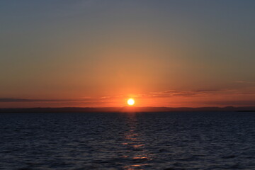 Naklejka na ściany i meble A beautiful sunset in the bay of La Paz , Baja California Sur in Mexico