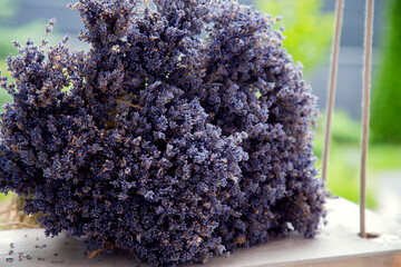 Flora. Bouquet of lavender flowers. A beautiful bouquet of lavender lies on a swing. The concept of...