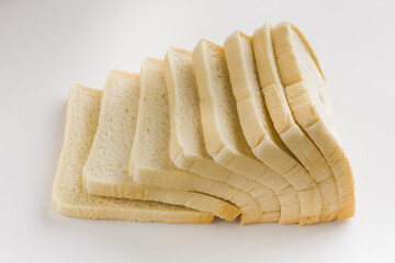 Loaf of sliced white bread isolated on white background