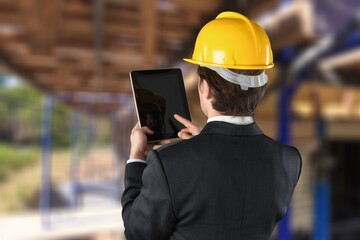 Construction Civil Engineer use technology software to scan building construction and inspection to show augmented reality in work,