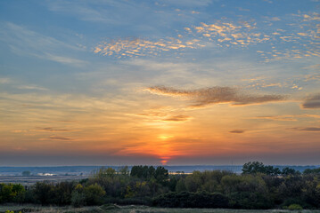 Beautiful sunset over the forest with beautiful sky.