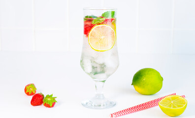 Refreshing cocktail with lime and strawberries