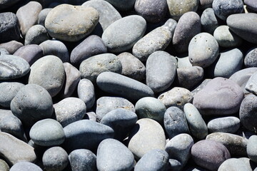 Closeup of smooth, gray river rocks