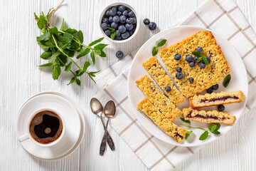sliced blueberry crumble pie on plate, top view