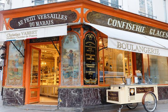 The French Traditional Bakery And Pastry Shop Au Petit Versailles Du Marais Located In Historical Marais Quarter At Night, Paris, France.