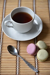 Tea pair with fragrant tea and pasta on a wooden mat.