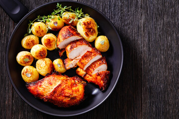 grilled chicken breasts with browned new potatoes