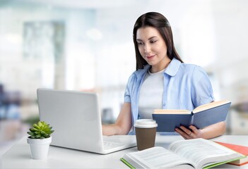 Cheerful Lady Sitting At Desk And Using Laptop Computer Working Online In Modern Office. Entrepreneurship And Business Career, Distance Freelance Job Concept