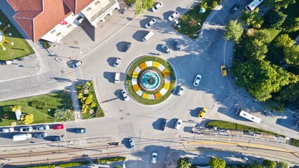 Aerial view of the roundabout at the city center. Tramway, city bus and other vehicles can be seen