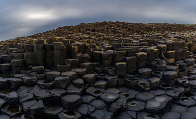 panorama view of the many volcanic basalt columns of the Giant's Causeway in Northern Ireland