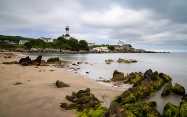 view of the historic Stroove Lighthouse and beach on the Inishowen Peninsula on Ireland's Wild...
