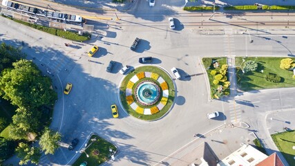 Aerial view of the roundabout at the city center. Tramway, city bus and other vehicles can be seen