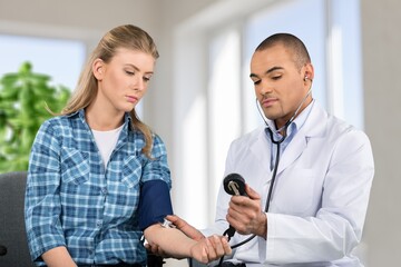 Fototapeta premium A patient visitng doctor due to suffering pain at hospital, concept of health check up, illness or decease and medical treatment.