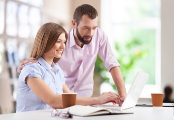 Fototapeta premium Portrait of success business people working together in home office. Couple teamwork concept
