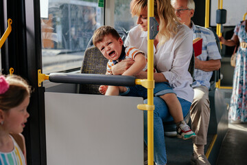 Little boy crying in the public transportation