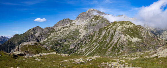 Naklejka na ściany i meble high mountain panorama with blue sky and clouds, Italian dolomites, Cima d'Asta Lagorai