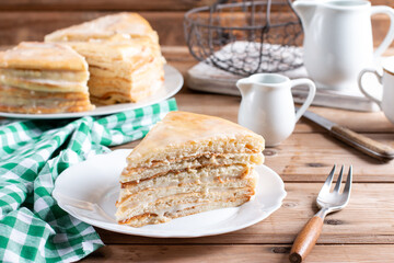 Sponge cake with butter cream on a table.