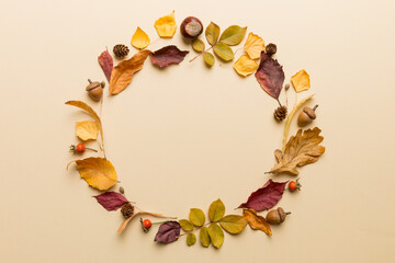 Autumn composition made of dried leaves, cones and acorns on table. Flat lay, top view