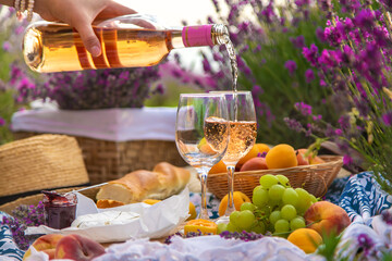 Wine in a lavender field. Selective focus.